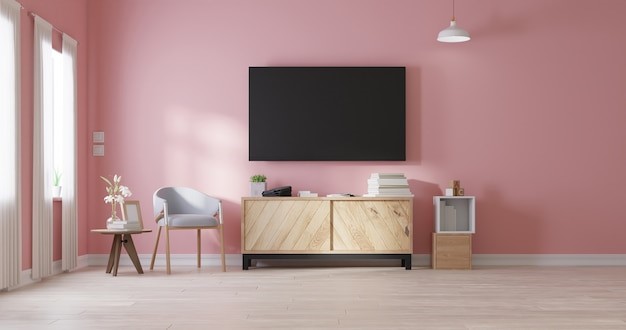 Ruang tv sederhana tanpa sofa bernuansa pink. 